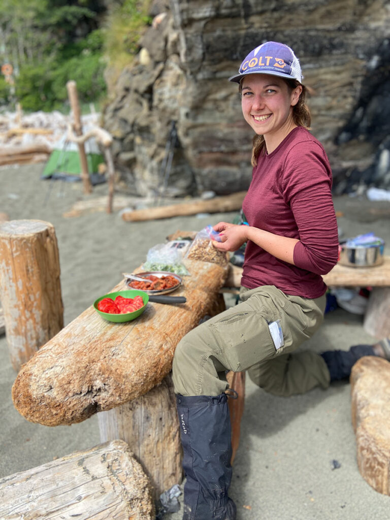 Leah cooking on the beach